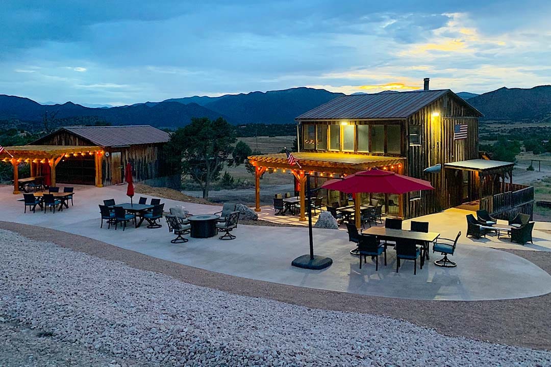 Gunslingers clubhouse and patio at dusk